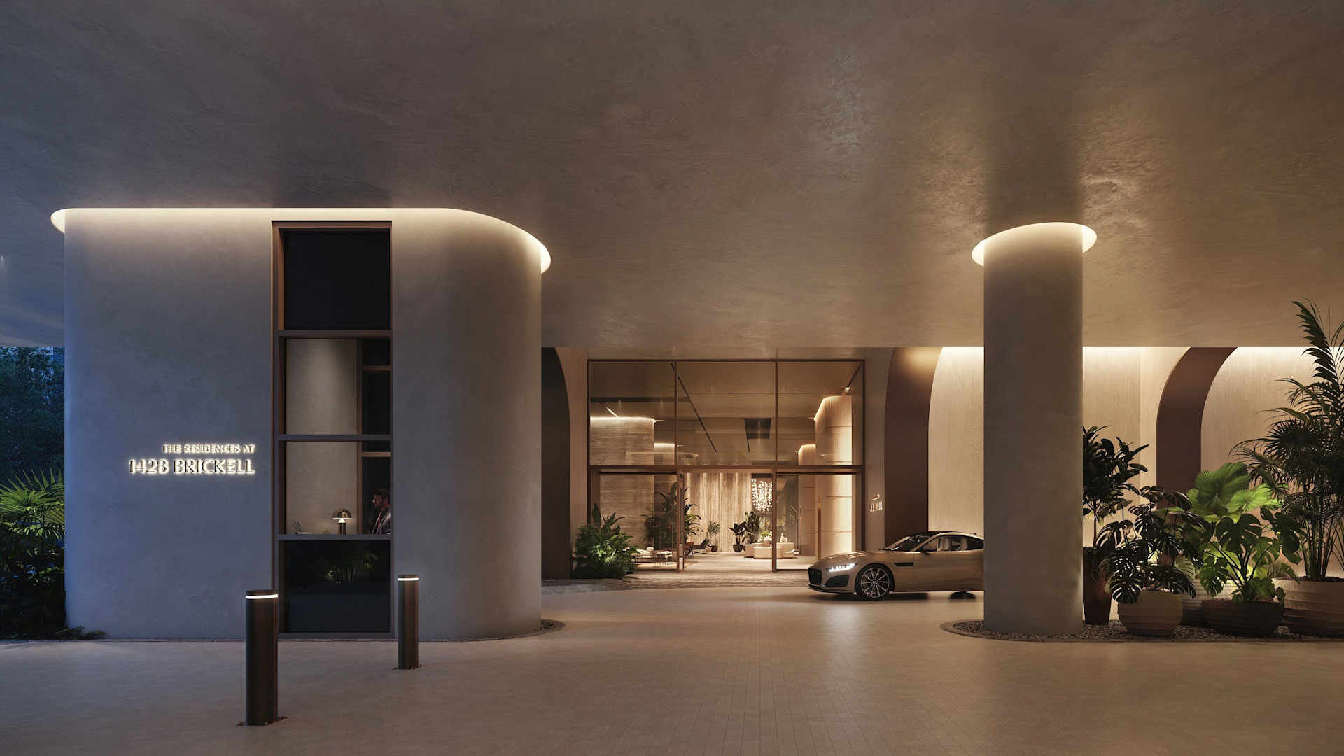 The Residences at 1428 Brickell - Luxury high-rise building entrance with modern architecture featuring concrete columns and a Porsche vehicle