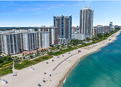 Aerial view of Miami Beach coastline with high-rise condominiums