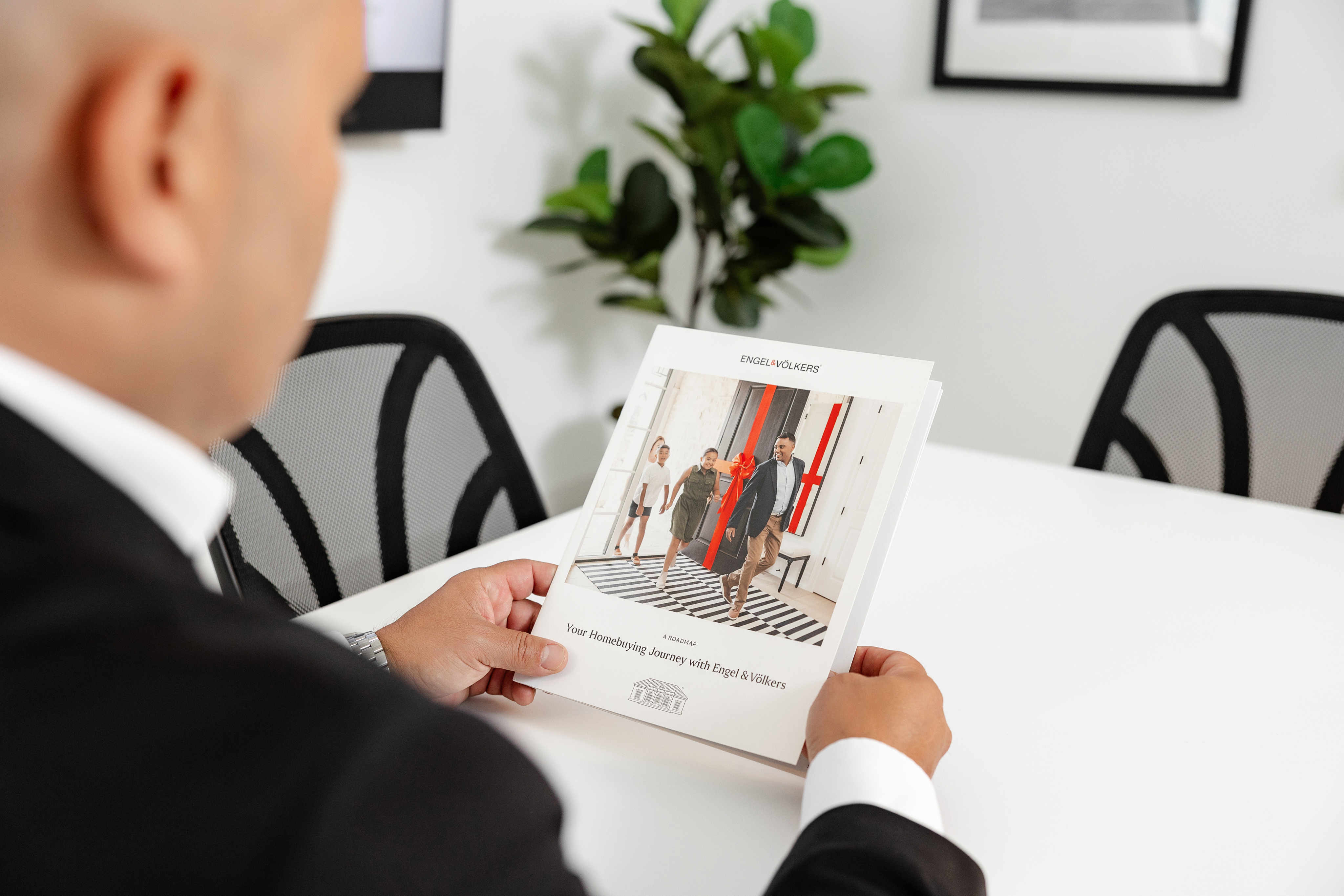 Real estate advisor reviewing property documents with client